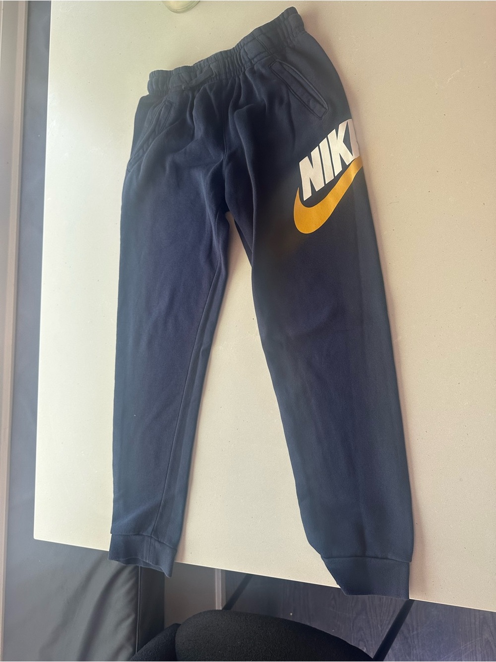 Nike Kids Navy Sweatpants with Yellow Swoosh
